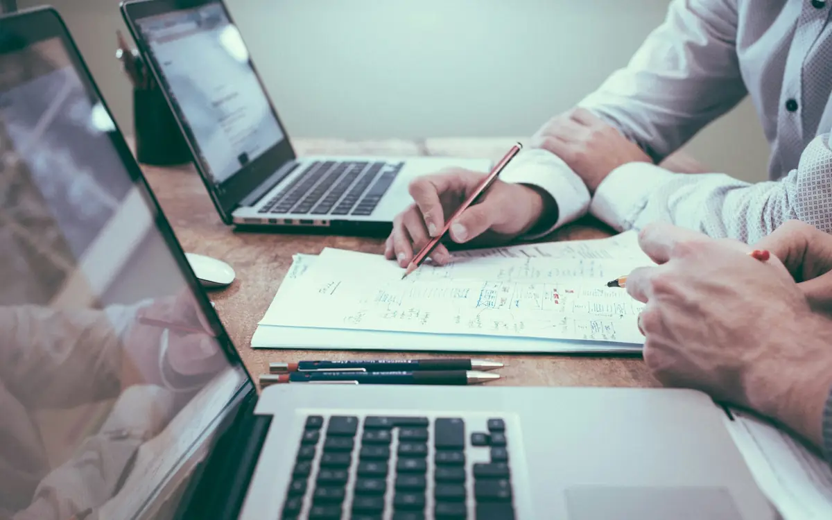 Business owner reviewing a software project plan with a developer