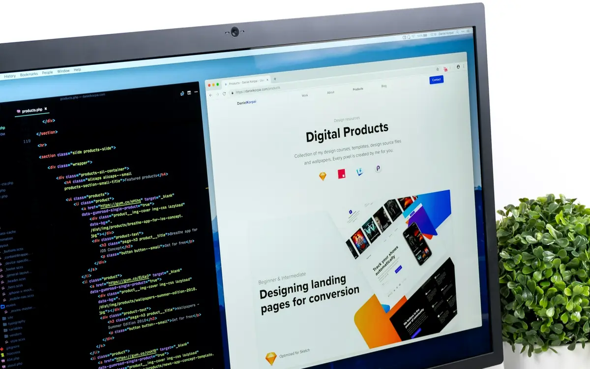 Responsive website design and code on a desktop monitor in a modern workspace